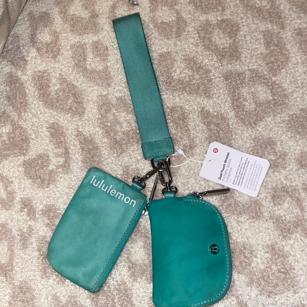 greenish wristlet It’s new with tags just got dirty on the way to lulu headquart